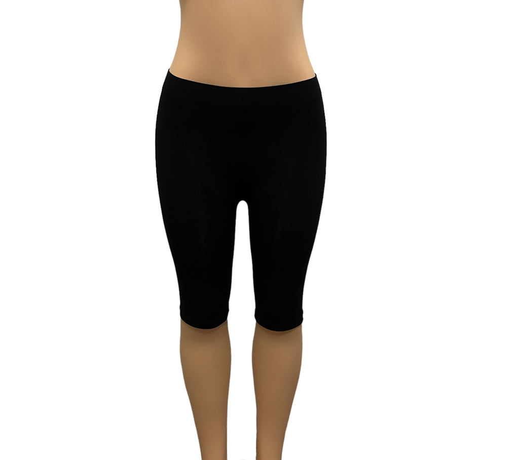 Stay comfortable and active with these versatile knee length leggings. Made from a combination of 90% nylon and 10% spandex, they offer a comfortable and flexible fit for a wide range of sizes. Whether you're lounging around the house or just need a little extra warmth, these slightly sheer leggings have you covered can easily be worn underneath clothing. 