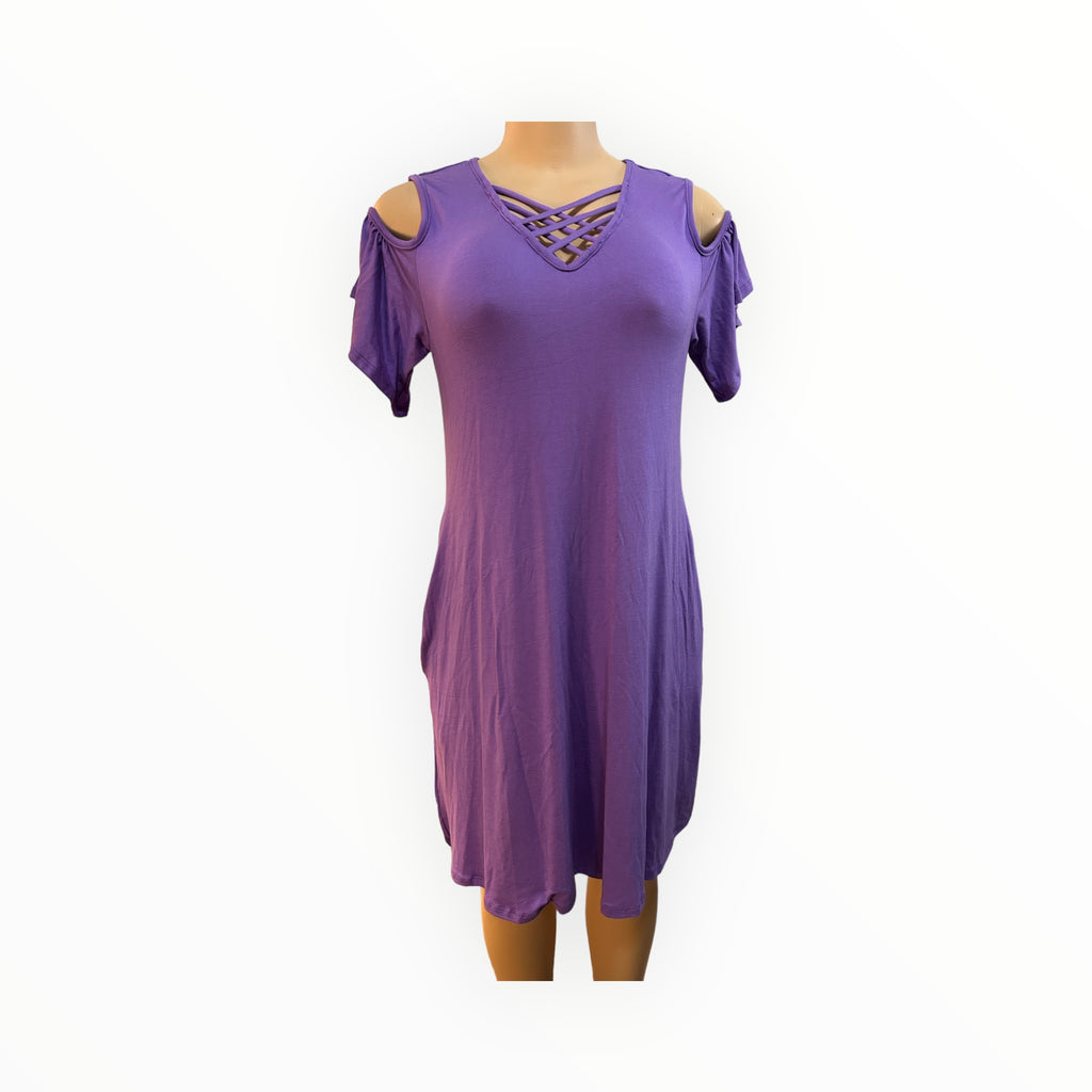 This casual dress is a loose fitted flowing dress. It's designed for comfort and style with a relaxed fit and a soft, breathable fabric blend of 95% Rayon and 5% spandex.
